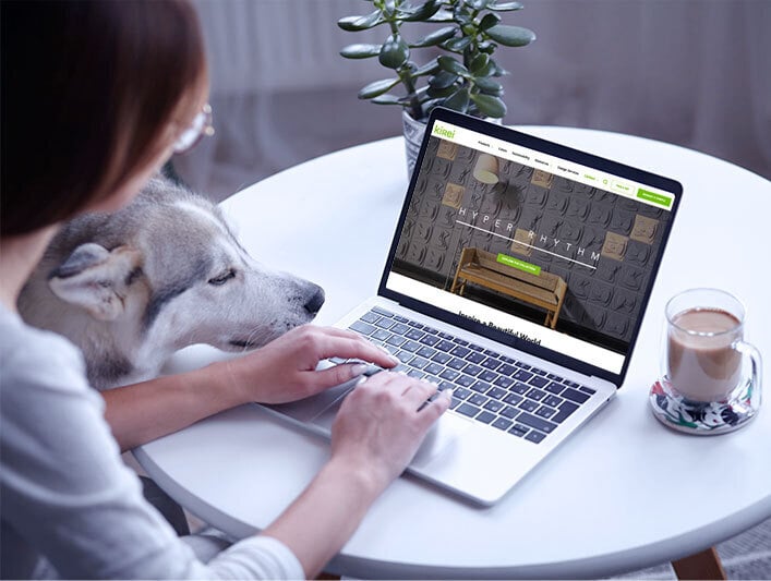 Woman at computer with dog